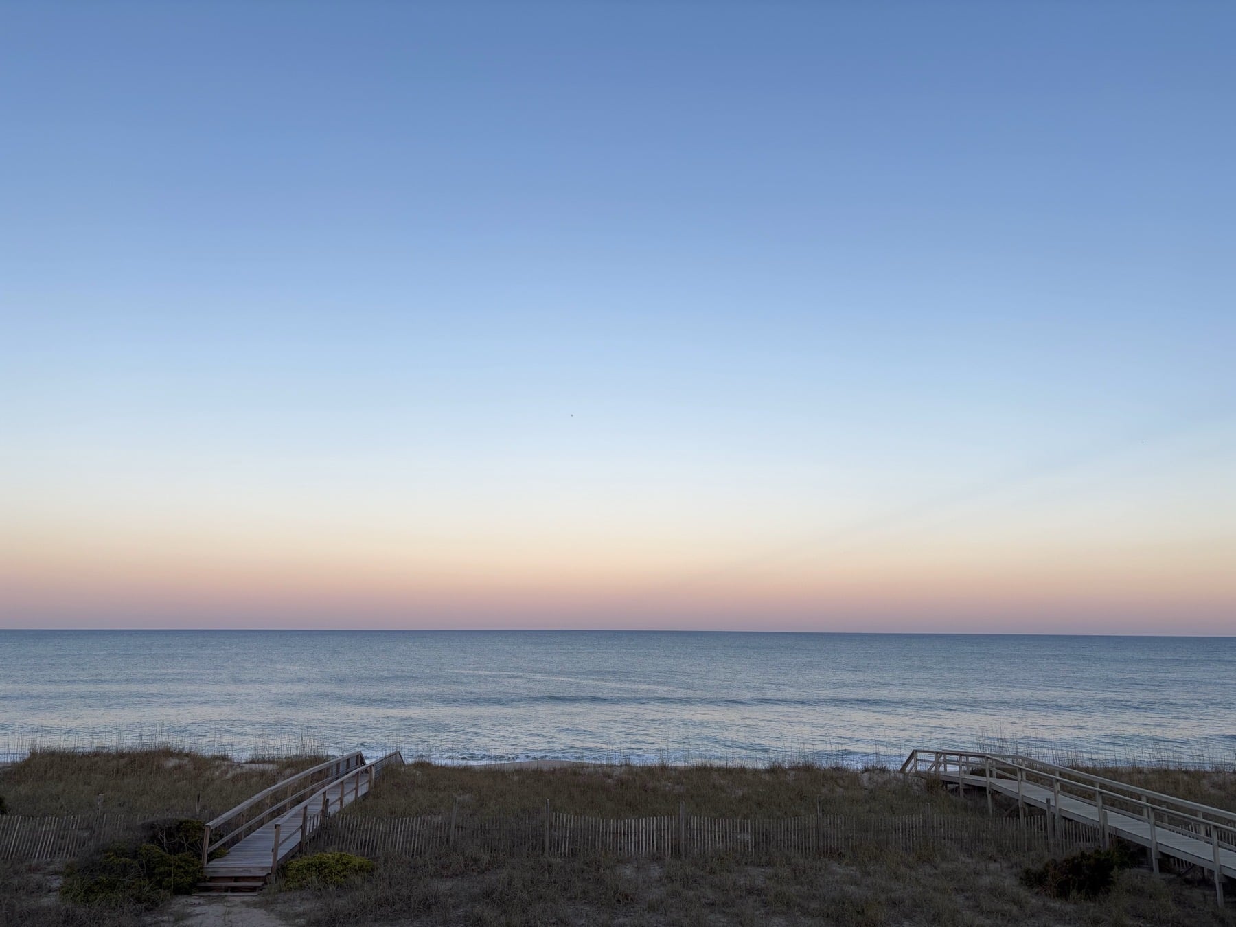 A quiet sunset walkway to the beach at Kure Beach, NC